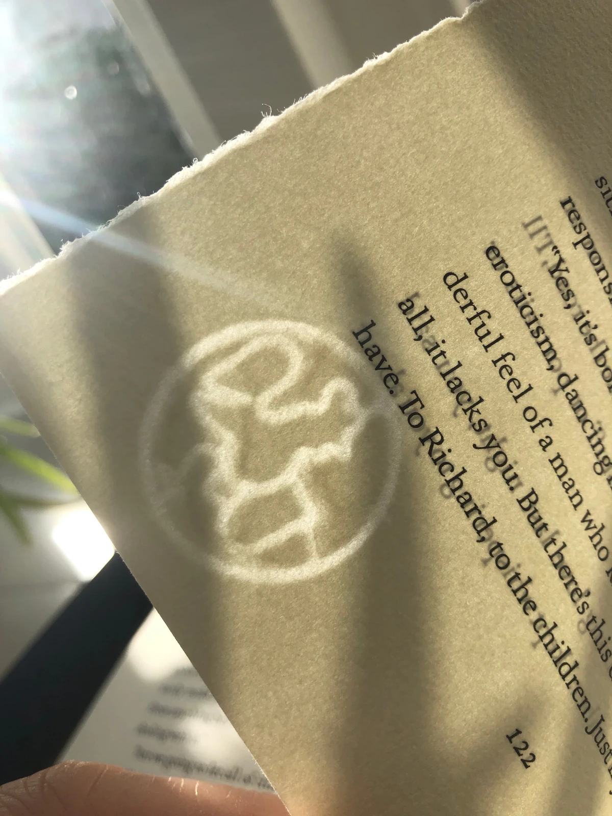 A page of The Bridges of Madison County from Suntup Editions held against the light, showing the Hahnemühle watermark