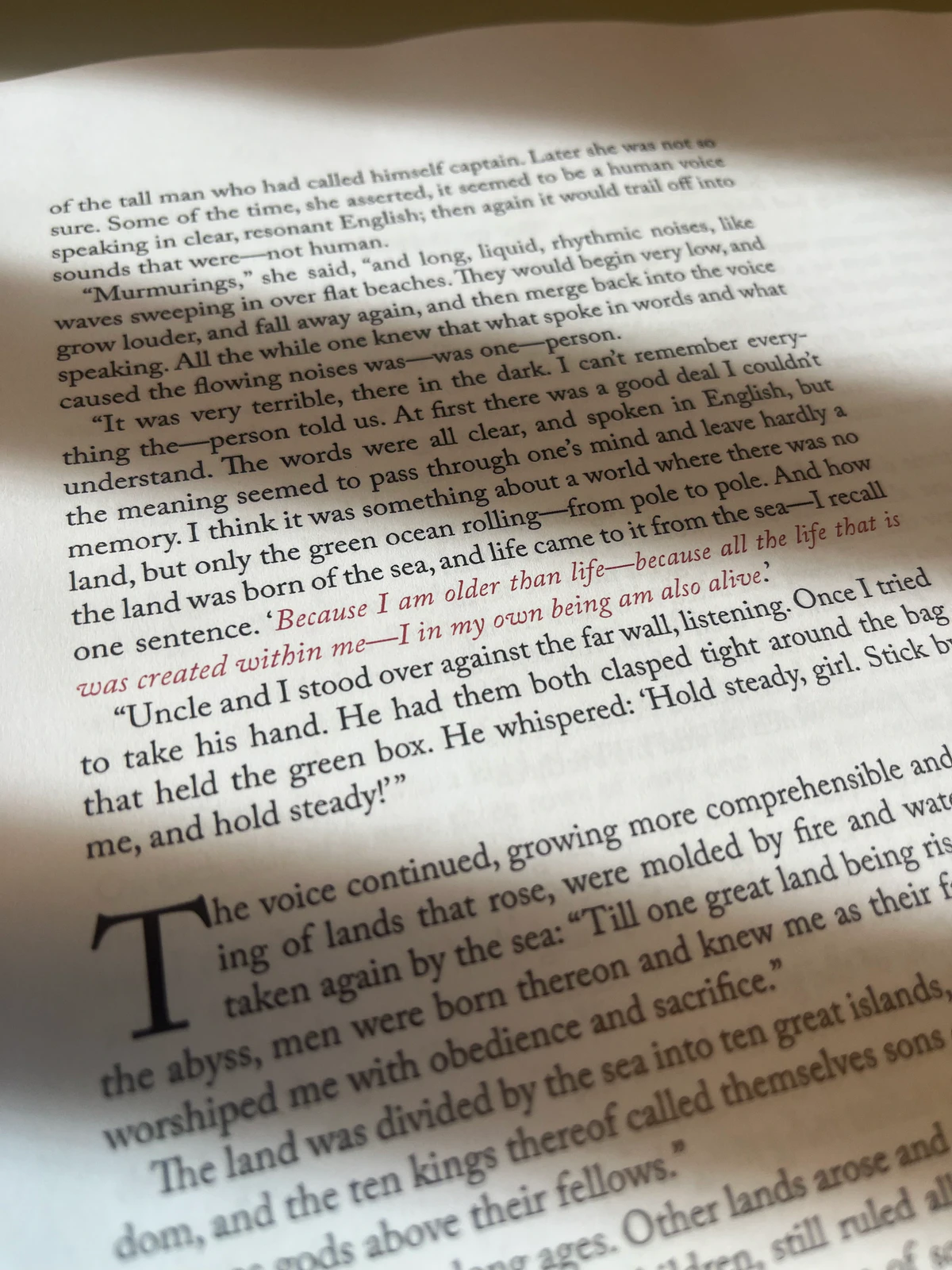 Alpha proof of a Claimed text page, with lines printed in red and a large initial T