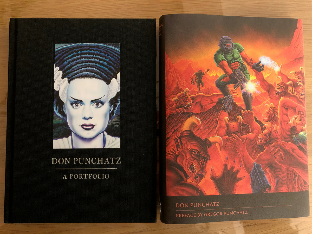 Don Punchatz: A Portfolio from Centipede Press, the black cloth cover beside the dust jacket with his Doom painting