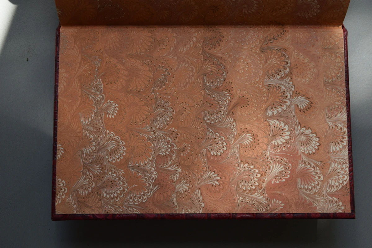 Copper-toned marbled endpaper of the lettered Red Dragon from Suntup Editions