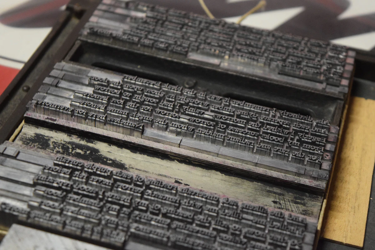 Stanzas of The Raven handset in Stempel Garamond, tied up and standing in galleys