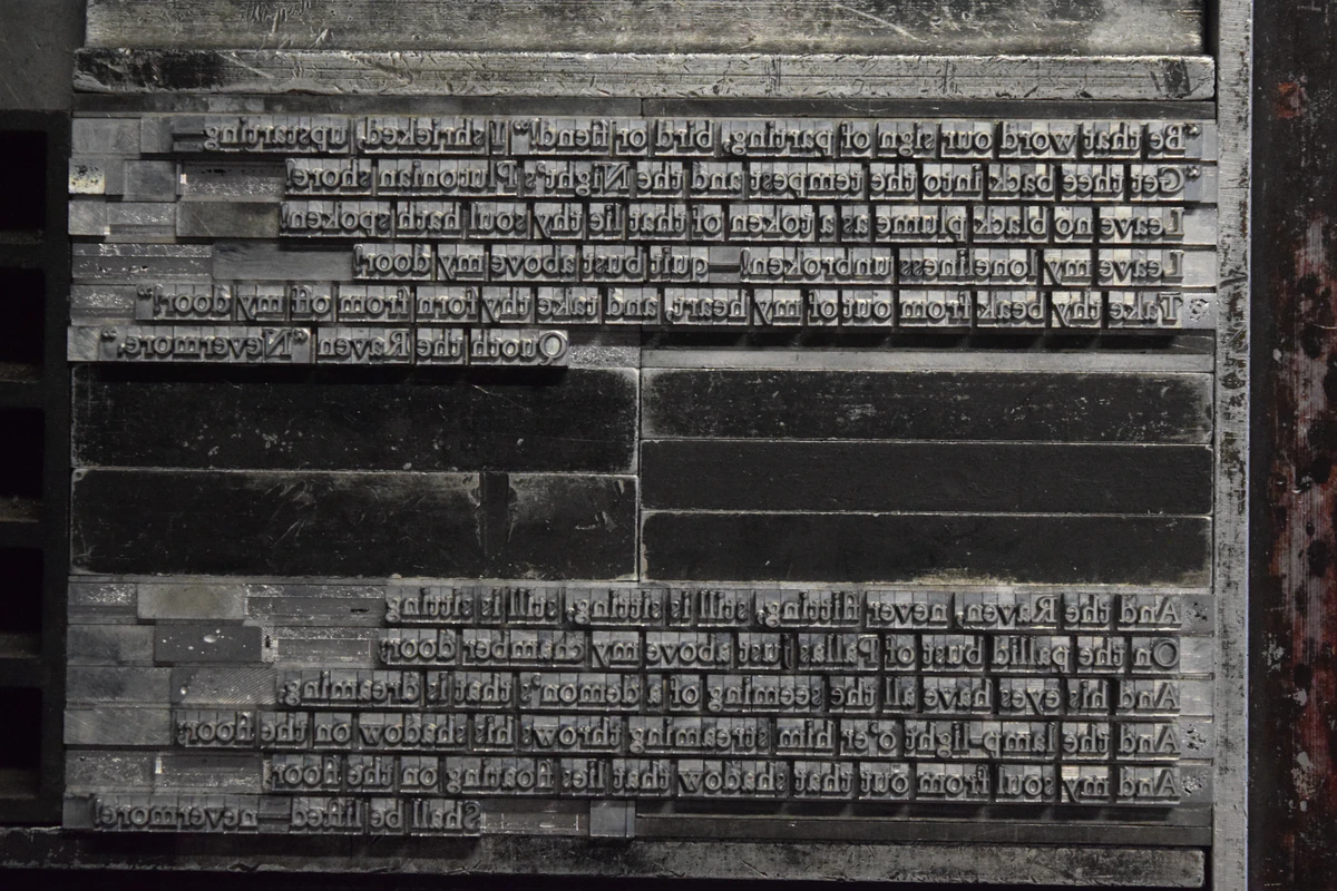 The last two stanzas of The Raven in handset metal type, with furniture between them