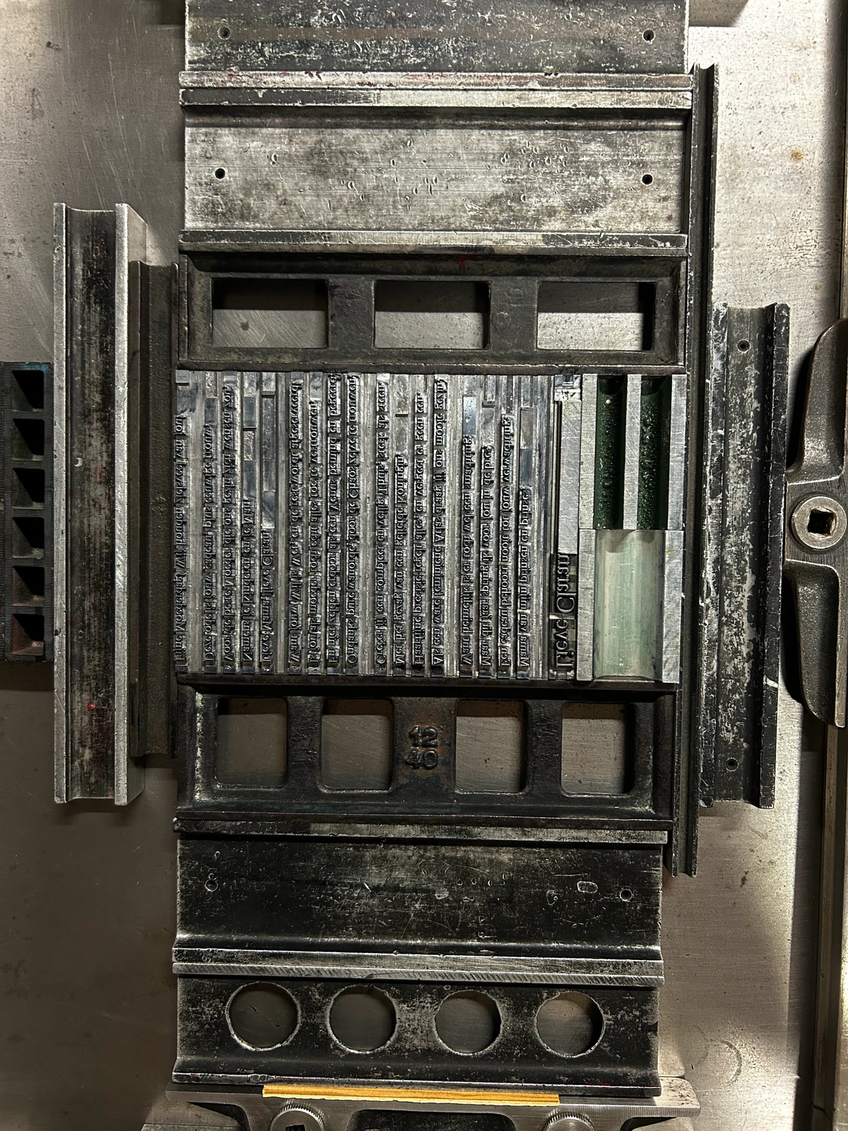 A page of The Raven in Stempel Garamond, locked up in the chase with steel furniture and quoins